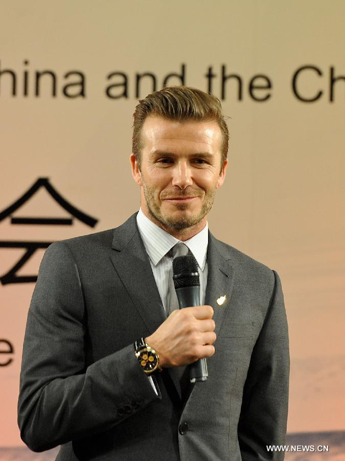 British footballer David Beckham reacts during a press conference in Beijing, capital of China, on March 20, 2013. David Beckham came to China as the ambassador for the youth football Program in China and the Chinese Super League (CSL). (Xinhua/Cao Can) 