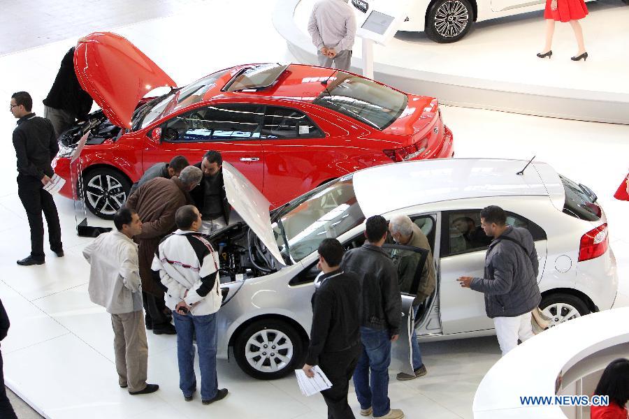 People visit the 16th International Automobile Fair of Algiers held in Algiers, Algeria, on March 19, 2013. Thousands of Algerian car fans rushed to the 16th International Automobile Fair of Algiers, which started on Tuesday in the Exhibition Palace in Algiers with the participation of 53 exhibitors representing more than 38 worldwide car brands.(Xinhua/Kadri Mohamed)  