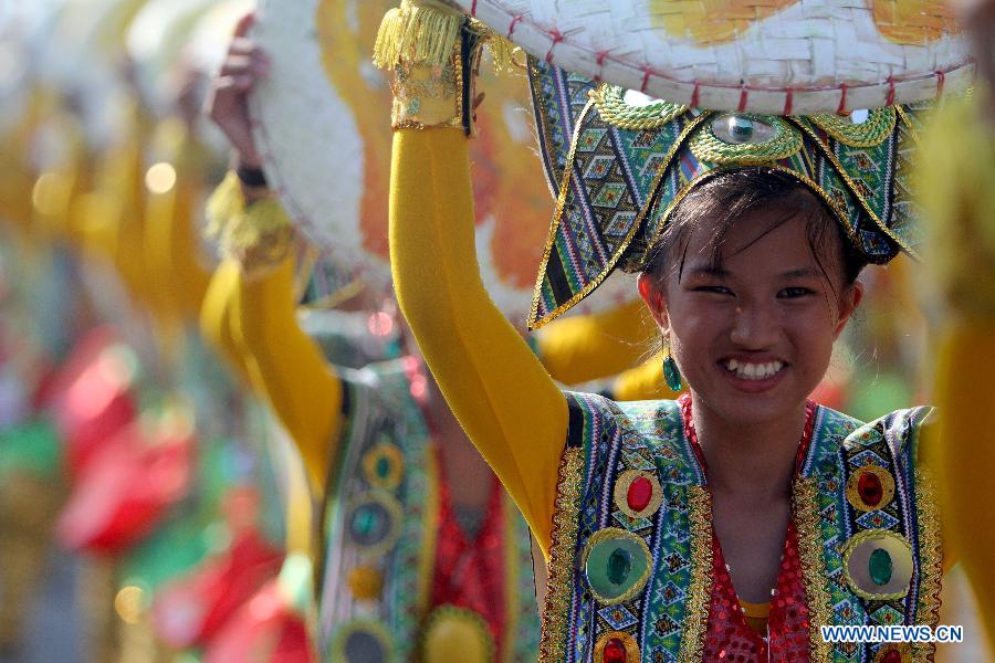 Dancers perform on a street during the Mango Festival in Zambales Province, the Philippines, March 20, 2013. The Mango Festival is held in Zambales annually to promote mango as the local signiture with colorful floats and street dances. (Xinhua/Rouelle Umali)