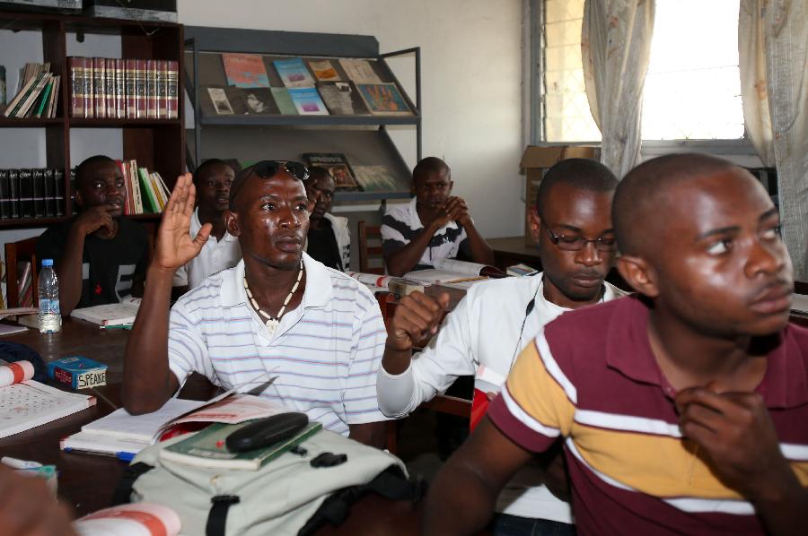 Students of Confucius Institute learn Chinese at Marien Ngouabi University in Brazzaville, the Republic of Congo, March 11, 2013. In recent years, Africa has witnessed a growing passion for the Chinese language and increasing requests to set up Chinese teaching institutions. To cater to this growing need, China opened the Confucius Institute at the University of Nairobi in 2005, the first of its kind in Africa. The latest figure shows that there are 31 Confucius Institutes and 5 Confucius Classrooms in Africa as of September 2012. (Xinhua/Meng Chenguang)