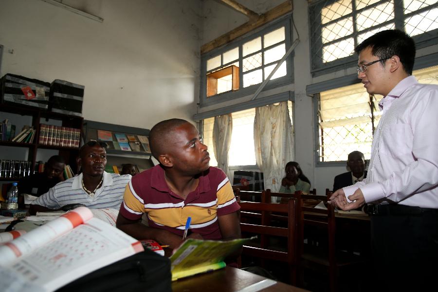 Students of Confucius Institute learn Chinese at Marien Ngouabi University in Brazzaville, the Republic of Congo, March 11, 2013. In recent years, Africa has witnessed a growing passion for the Chinese language and increasing requests to set up Chinese teaching institutions. To cater to this growing need, China opened the Confucius Institute at the University of Nairobi in 2005, the first of its kind in Africa. The latest figure shows that there are 31 Confucius Institutes and 5 Confucius Classrooms in Africa as of September 2012. (Xinhua/Meng Chenguang)