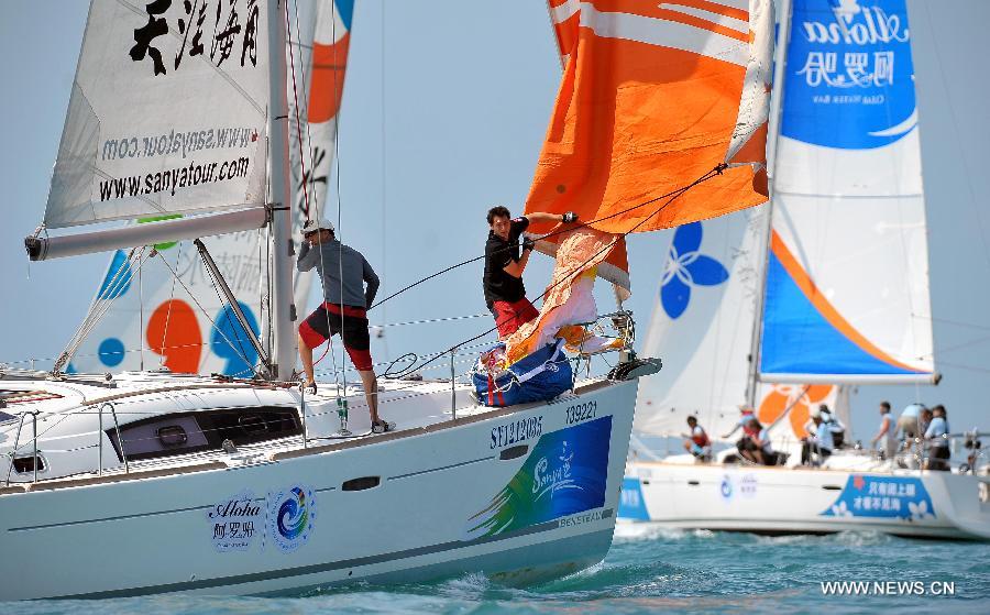 The sailing boats compete during the second day of racing at the 2013 Round Hainan International Regatta in Sanya, capital of south China's Hainan Province, March 22, 2013. (Xinhua/Guo Cheng)