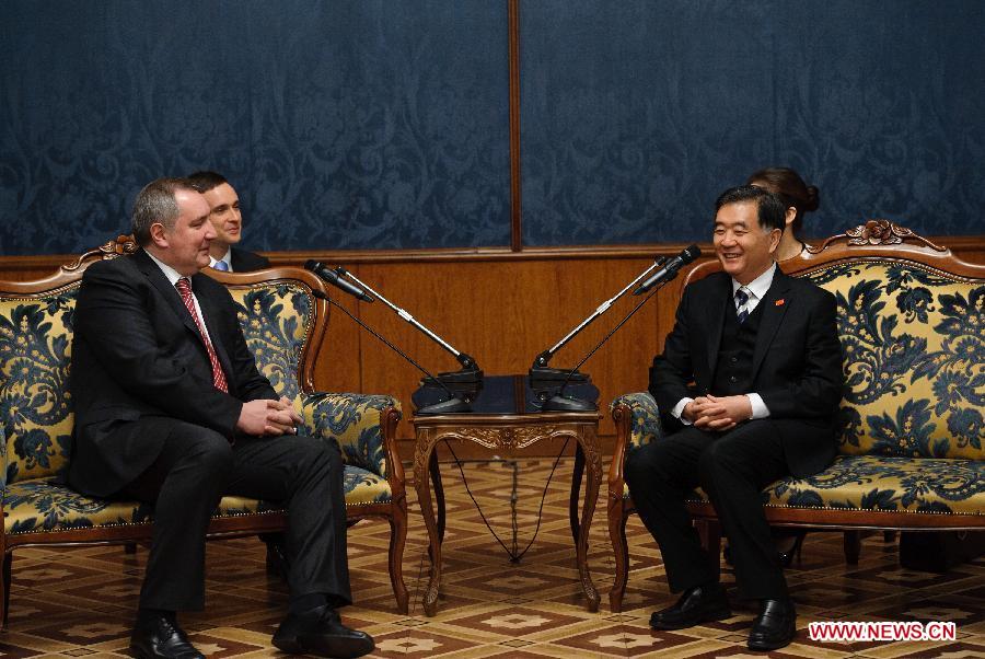 Visiting Chinese Vice Premier Wang Yang (R) meets with Russian Deputy Prime Minister Dmitry Rogozin in Moscow, Russia, March 22, 2013. Chinese Vice Premier Wang Yang, who is visiting Moscow to inspect preparations for the "Tourism Year of China" in Russia, has called for enhanced tourism cooperation between China and Russia. (Xinhua/Jiang Kehong)