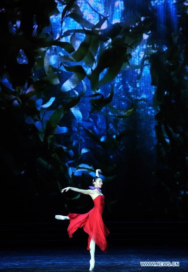 Artists perform during the opening ceremony of the "Tourism Year of China" in Moscow, March 22, 2013. The "China-Russia Tourism Year" program, which began last year with the "Tourism Year of Russia" in China, aims to foster tourism ties and humanistic exchanges between the two countries. (Xinhua/Jiang Kehong)