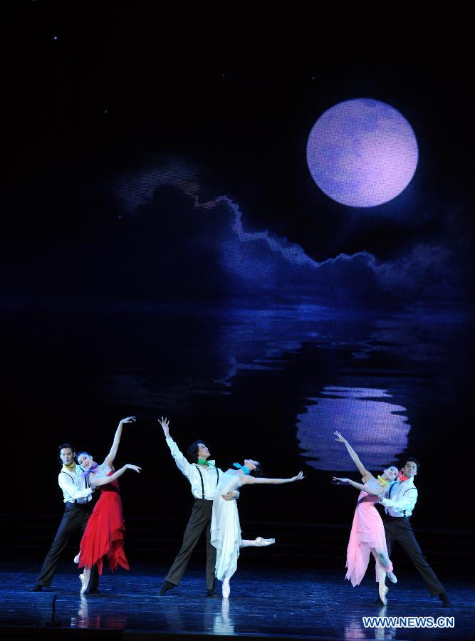 Artists perform during the opening ceremony of the "Tourism Year of China" in Moscow, March 22, 2013. The "China-Russia Tourism Year" program, which began last year with the "Tourism Year of Russia" in China, aims to foster tourism ties and humanistic exchanges between the two countries. (Xinhua/Jiang Kehong)