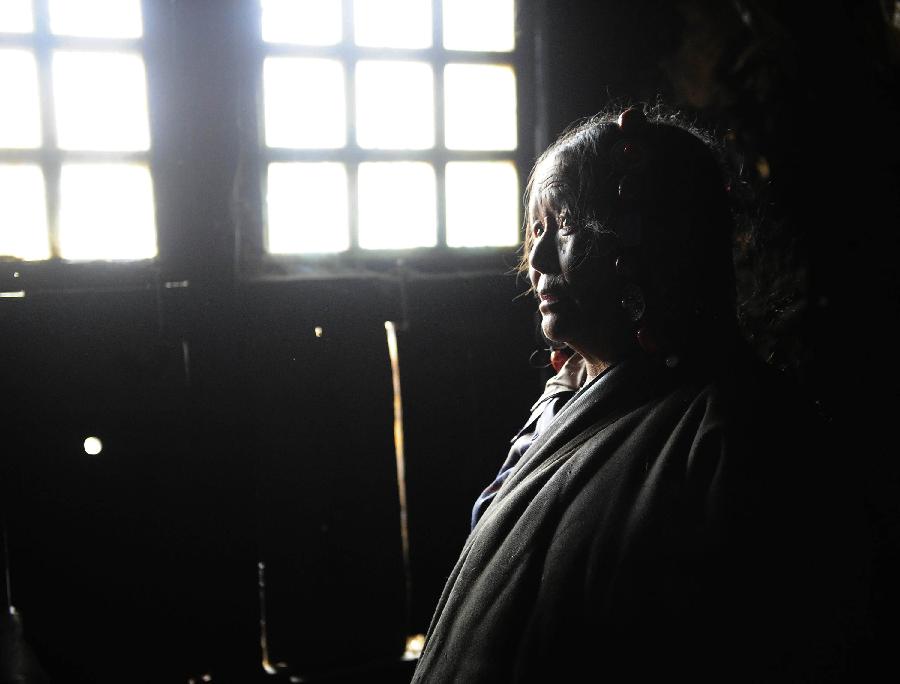 The 65-year-old Haji is pictured in her stone house which is aged over 600 years in Yangda Village of Riwar Township in Suoxian County in the Nagqu Prefecture, southwest China's Tibet Autonomous Region. Three stone houses, each with the age exceeding more than 600 years, are preserved well in the village. (Xinhua/Liu Kun)