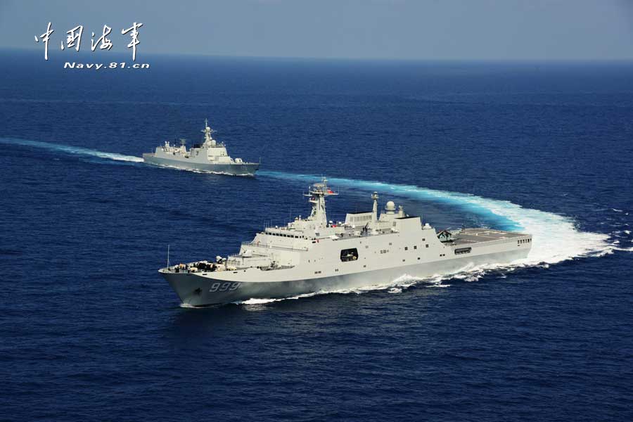 The picture shows the "Jinggangshan" amphibious dock landing ship, the "Lanzhou" guided missile destroyer, the "Yulin" guided missile frigate and the "Hengshui" guided missile frigate of the combat-readiness patrol and high-sea training taskforce under the South China Sea Fleet of the Navy of the Chinese People's Liberation Army (PLA) conducts training on the subject of battle-order deploying in the waters of the South China Sea on March 22, 2013. (PLA Daily/Qian Xiaohu Gao Yi and Gan Jun)