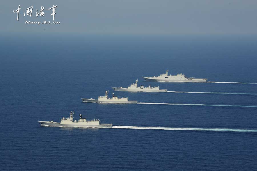 The picture shows the "Jinggangshan" amphibious dock landing ship, the "Lanzhou" guided missile destroyer, the "Yulin" guided missile frigate and the "Hengshui" guided missile frigate of the combat-readiness patrol and high-sea training taskforce under the South China Sea Fleet of the Navy of the Chinese People's Liberation Army (PLA) conducts training on the subject of battle-order deploying in the waters of the South China Sea on March 22, 2013. (PLA Daily/Qian Xiaohu Gao Yi and Gan Jun)