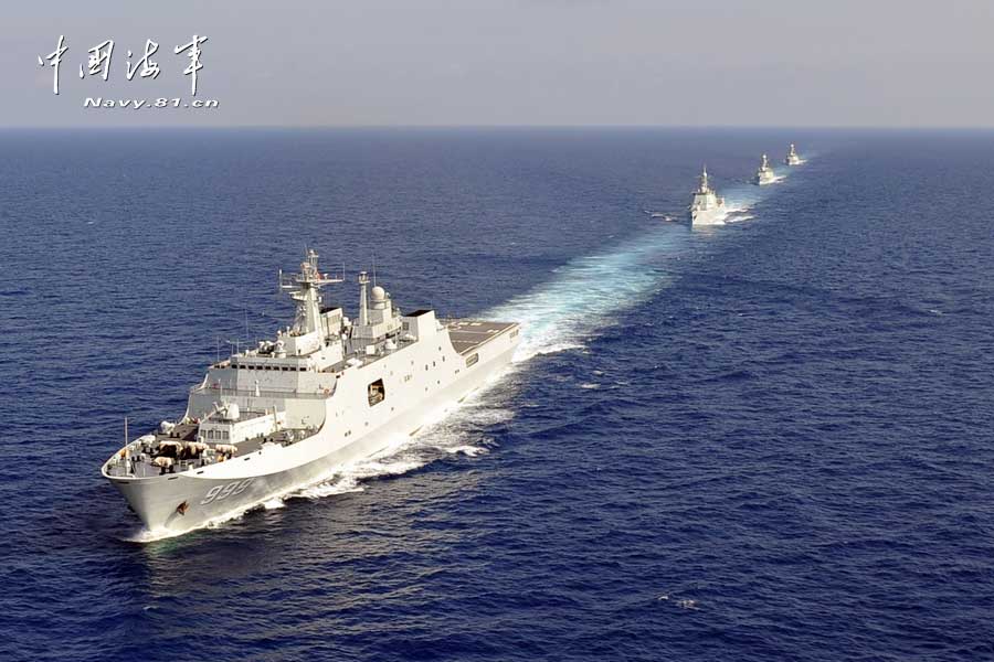 The picture shows the "Jinggangshan" amphibious dock landing ship, the "Lanzhou" guided missile destroyer, the "Yulin" guided missile frigate and the "Hengshui" guided missile frigate of the combat-readiness patrol and high-sea training taskforce under the South China Sea Fleet of the Navy of the Chinese People's Liberation Army (PLA) conducts training on the subject of battle-order deploying in the waters of the South China Sea on March 22, 2013. (PLA Daily/Qian Xiaohu Gao Yi and Gan Jun)