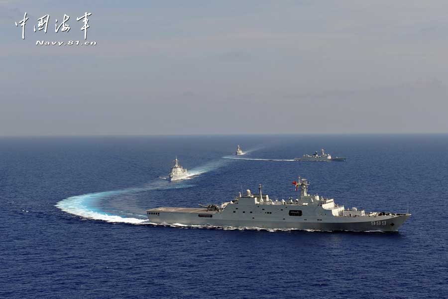 The picture shows the "Jinggangshan" amphibious dock landing ship, the "Lanzhou" guided missile destroyer, the "Yulin" guided missile frigate and the "Hengshui" guided missile frigate of the combat-readiness patrol and high-sea training taskforce under the South China Sea Fleet of the Navy of the Chinese People's Liberation Army (PLA) conducts training on the subject of battle-order deploying in the waters of the South China Sea on March 22, 2013. (PLA Daily/Qian Xiaohu Gao Yi and Gan Jun)