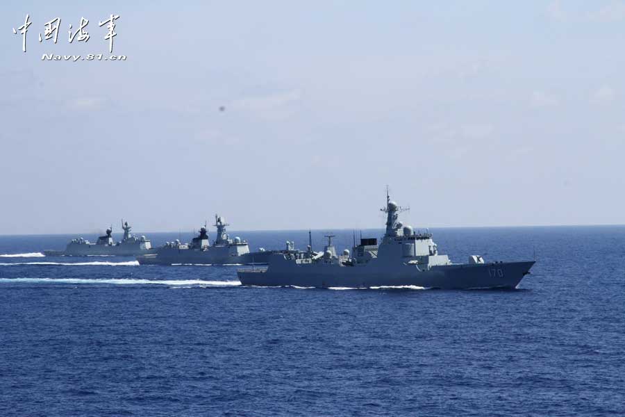 The picture shows the "Jinggangshan" amphibious dock landing ship, the "Lanzhou" guided missile destroyer, the "Yulin" guided missile frigate and the "Hengshui" guided missile frigate of the combat-readiness patrol and high-sea training taskforce under the South China Sea Fleet of the Navy of the Chinese People's Liberation Army (PLA) conducts training on the subject of battle-order deploying in the waters of the South China Sea on March 22, 2013. (PLA Daily/Qian Xiaohu Gao Yi and Gan Jun)