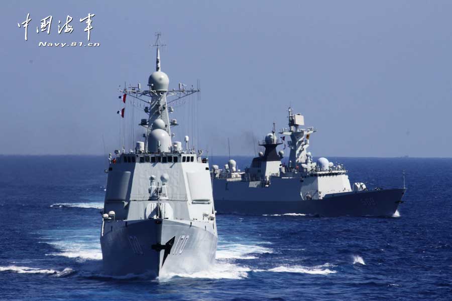 The picture shows the "Jinggangshan" amphibious dock landing ship, the "Lanzhou" guided missile destroyer, the "Yulin" guided missile frigate and the "Hengshui" guided missile frigate of the combat-readiness patrol and high-sea training taskforce under the South China Sea Fleet of the Navy of the Chinese People's Liberation Army (PLA) conducts training on the subject of battle-order deploying in the waters of the South China Sea on March 22, 2013. (PLA Daily/Qian Xiaohu Gao Yi and Gan Jun)