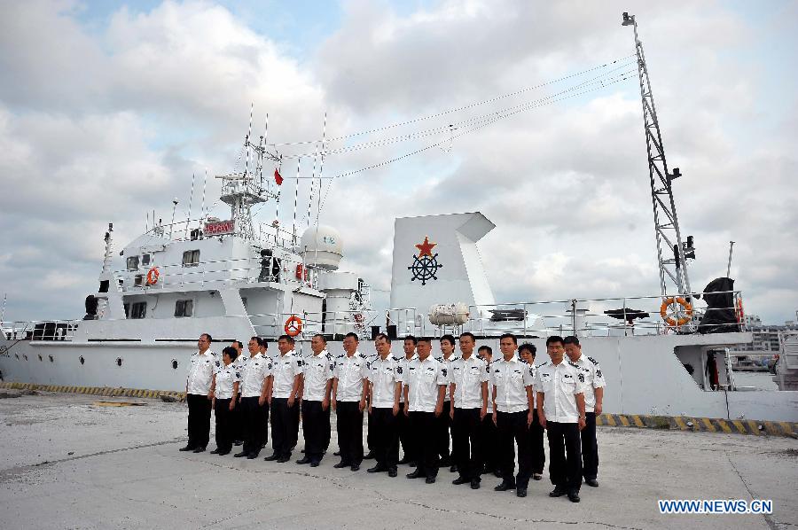 Crew of a fishery administration ship attend a ceremony before leaving the Xingang Port of Haikou, capital of south China's Hainan Province, March 26, 2013, to conduct fishery patrol missions in waters off the Xisha Islands and Huangyan Islands in the South China Sea. (Xinhua/Guo Cheng) 