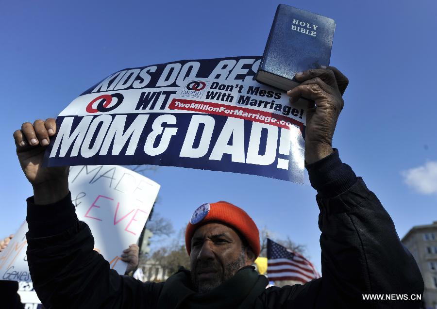 Supporters and opponents of same-sex marriage rally outside the U.S. Supreme Court in Washington D.C., capital of the United States, March 26, 2013. U.S. Supreme Court on Tuesday heard arguments of California's ban on same-sex marriage, opening two days of monumental proceedings on the issue. (Xinhua/Wang Yiou) 