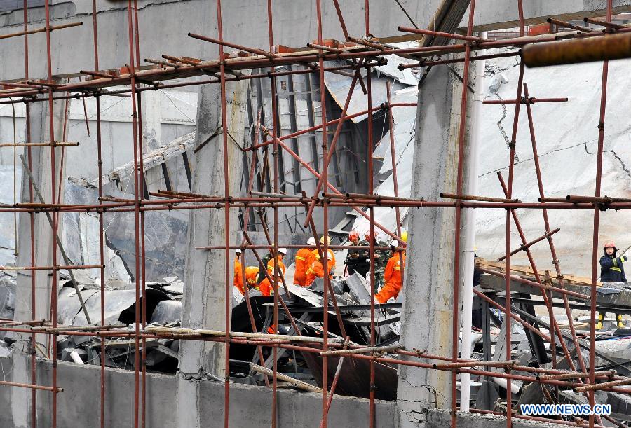 Firefighters conduct search and rescue work at the scene of a building collapse accident in Zixing City, central China's Hunan Province, March 27, 2013. Part of a hotel under construction collapsed on Wednesday morning, which buried six people, five of whom have been rescued. (Xinhua)