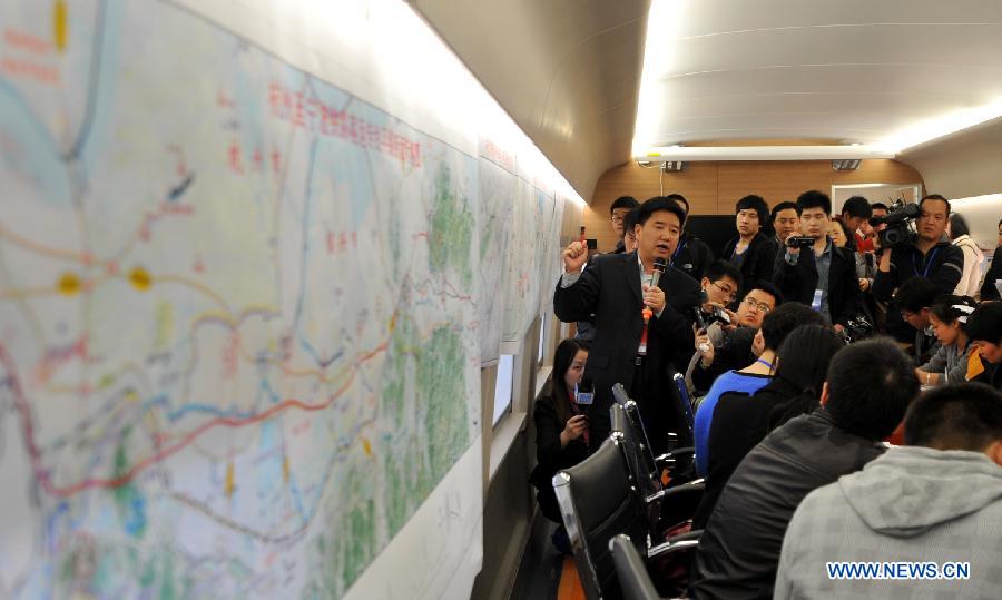 A railway official holds a press briefing during a test run of the Nanjing-Hangzhou High-Speed Railway on March 28, 2013. The new Nanjing-Hangzhou High-Speed Railway is a supplement to railway travelling within China's Yangtze River Delta. The 249-kilometer rail line will reduce travel time from Nanjing to Hangzhou to about an hour. (Xinhua/Wang Dingchang)
