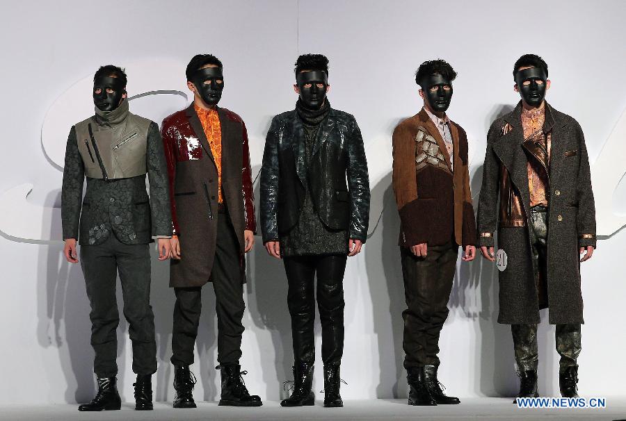 Models present creations during the 2013 "Sundance Cup" China Fashion Business Men's Clothing Design Competition in Beijing, capital of China, March 27, 2013. A total of 600 creations participated in the competition held in Beijing on Thursday. (Xinhua/Wan Xiang)