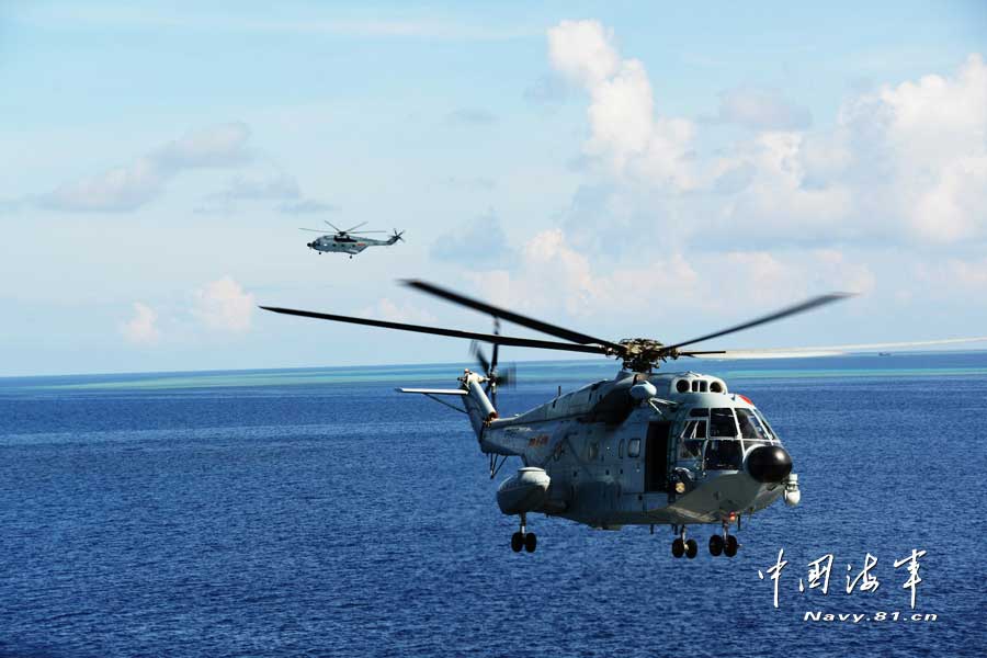 A joint maneuver taskforce under the South Sea Fleet of the Navy of the Chinese People’s Liberation Army (PLA) patrols the Meiji Reef, a fishing area and shelter for Chinese fishermen on March 27, 2013. (navy.81.cn/Qian Xiaohu, Song Xin) 