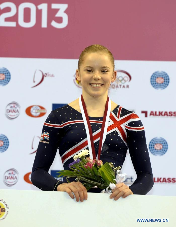 Gabrielle Jupp of Britain reacts during the awarding ceremony for the uneven bars at the 6th FIG Artistic Gymnastics world Challenge Cup in Doha, Qatar, March 28, 2013. Jupp took the bronze medal with 13.925 points. (Xinhua/Chen Shaojin)