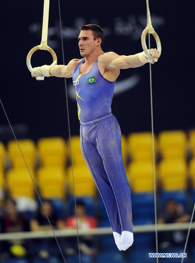 Arthur Nabarrete of Brazil competes during Men's Rings Final at the FIG Artistic Gymnastics World Challenge cup in Doha, capital of Qatar, March 28, 2013. Nabarrete won the gold with 15.700. (Xinhua/Chen Shaojin)