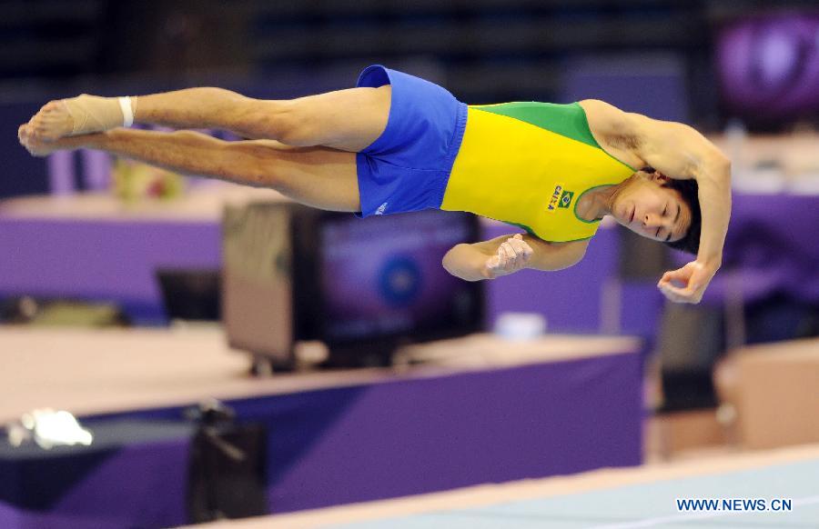 Arthur Oyakawa of Brazil competes during Men's Floor Final at the FIG Artistic Gymnastics World Challenge cup in Doha, capital of Qatar, March 28, 2013. Oyakawa won the silver with 14.900. (Xinhua/Chen Shaojin)