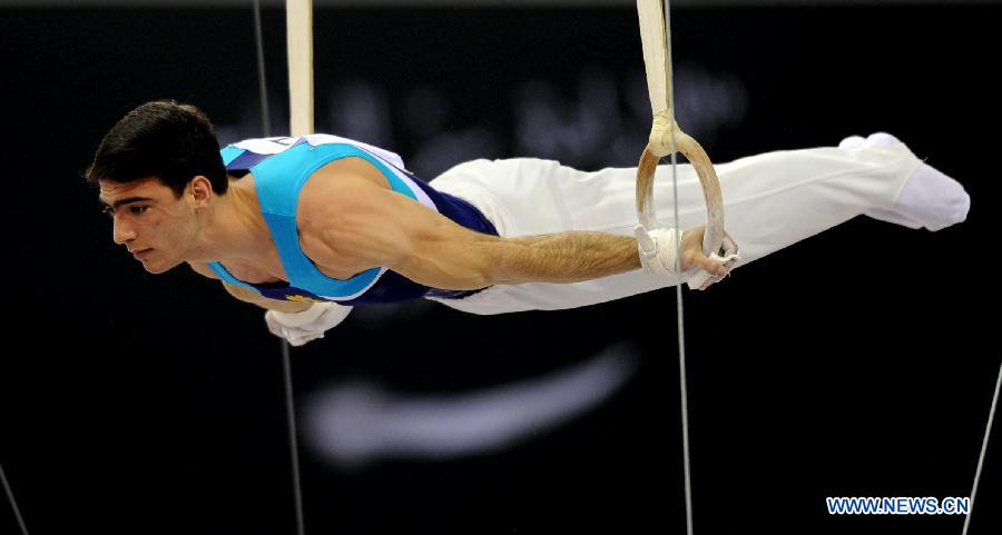 Artur Tovmasyan of Armenia competes during Men's Rings Final at the FIG Artistic Gymnastics World Challenge cup in Doha, capital of Qatar, March 28, 2013. Tovmasyan won the silver with 15.400. (Xinhua/Chen Shaojin)