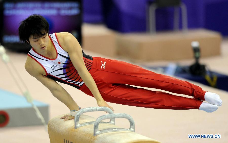 Oka Jumpei of Japan competes during Men's Pommel Horse enent at the FIG Artistic Gymnastics World Challenge cup in Doha, capital of Qatar, March 28, 2013. Berki won the silver with 15.125. (Xinhua/Chen Shaojin)
