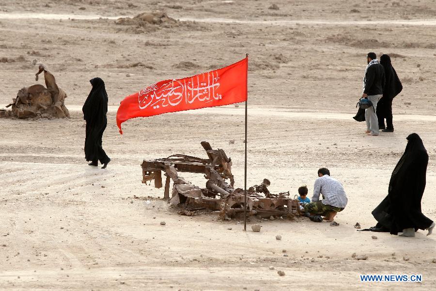 Iranians visit Talaeiyeh, a battlefield of the 1980-1988 Iran-Iraq war, in Iran's southwestern province of Khuzestan, during the Iranian New Year holidays on March 29, 2013. (Xinhua/Ahmad Halabisaz) 