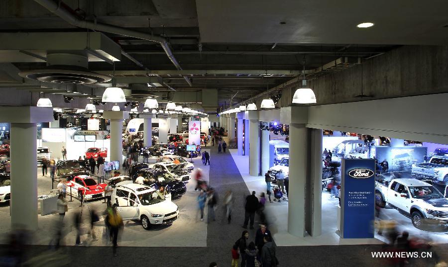 People visit the 2013 New York International Auto Show in New York, on March 29, 2013. The 2013 New York International Auto Show opened to the public on Friday. (Xinhua/Cheng Li) 