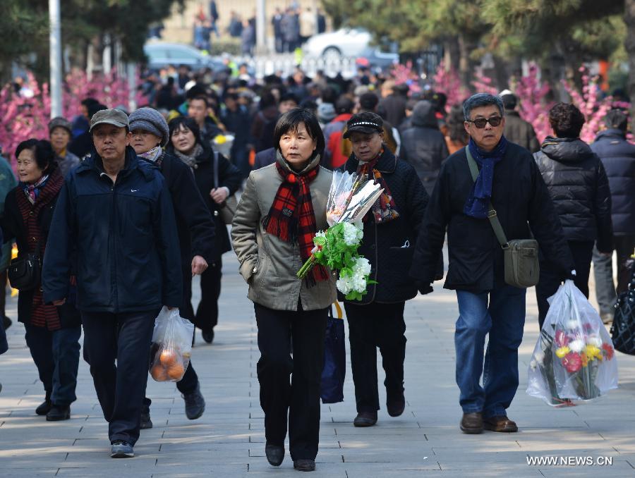 People visit the gravesites of their relatives and ancestors at the Babaoshan People's Cemetery in Beijing, capital of China, March 30, 2013. Citizens have begun to remember and honour their deceased family members and ancestors as the annual Qingming Festival draws near. The Qingming Festival, also known as Tomb Sweeping Day, is usually observed by the Chinese around April 5 each year. (Xinhua/Wang Quanchao)