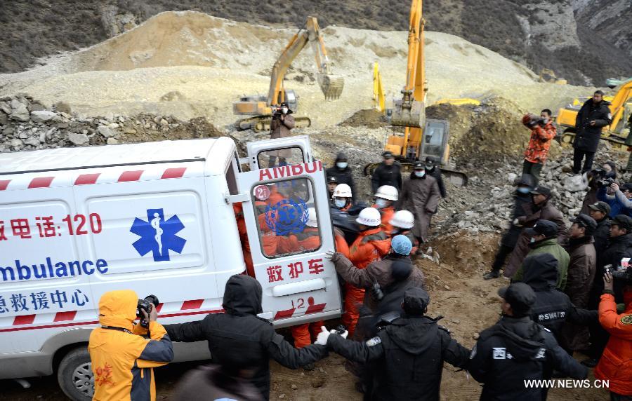 Firefighters carry bodies of two miners at the site where a large-scale landslide hit a mining area in Maizhokunggar County of Lhasa, southwest China's Tibet Autonomous Region, March 30, 2013. Rescuers have found two bodies and are still searching for survivors more than 37 hours after a massive landslide buried 83 miners at the polymetal mine in Tibet. (Xinhua/Purbu Zhaxi)