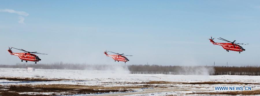 Helicopters are seen in a flight training to extinguish forest fire in Daqing City, northeast China's Heilongjiang Province, March 28, 2013. As the warm and dry spring season draws near in northern China, the risk of forest fire increases in many places. (Xinhua/Han Xinghua) 
