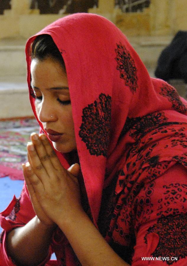 A Pakistani Christian attends an Easter Mass at a church in eastern Pakistan's Lahore on March 31, 2013. Christians around the world are marking Easter Day, a Christian holiday to celebrate the resurrection of Jesus Christ on the third day of his crucifixion at Calvary as described in the New Testment. (Xinhua/Sajjad) 