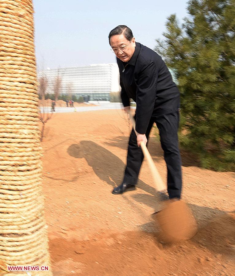 Yu Zhengsheng plants a sapling during a tree-planting event in Fengtai District in Beijing, capital of China, April 2, 2013. Chinese top leaders Xi Jinping, Li Keqiang, Zhang Dejiang, Yu Zhengsheng, Liu Yunshan, Wang Qishan and Zhang Gaoli joined in the tree planting event here on Tuesday. (Xinhua/Liu Jiansheng)