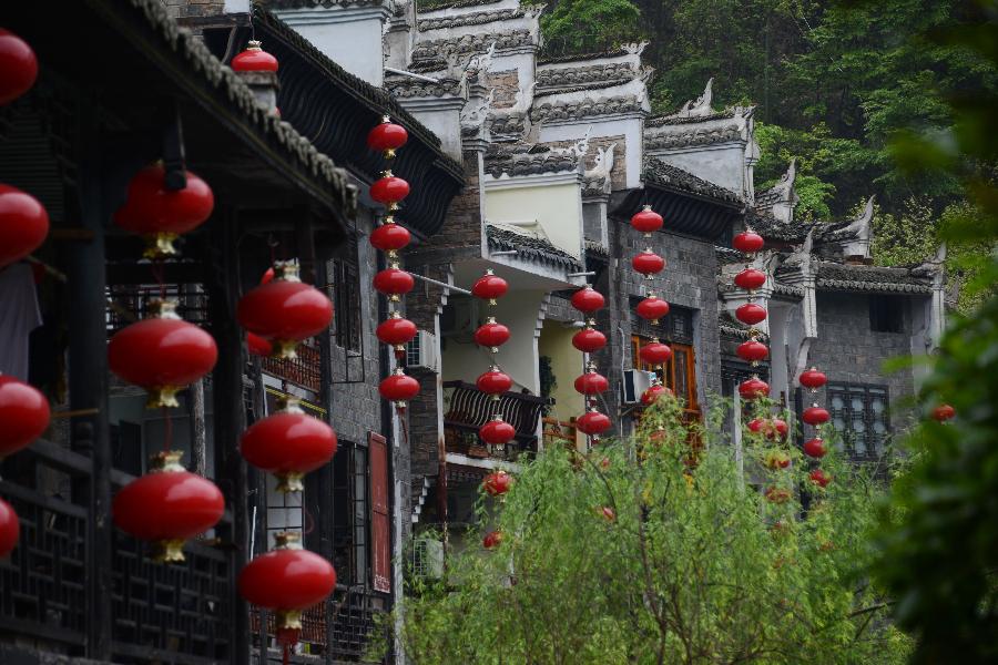 Houses are decorated by red lanterns in Zhenyuan County in southwest China's Guizhou Province, March 31, 2013. The county could date back 2,280 years with the Wuyang River running through it. As many ancient style architectures were built along the river, the ancient town was dubbed as "Oriental Venice" by tourists. (Xinhua/Hu Yan) 