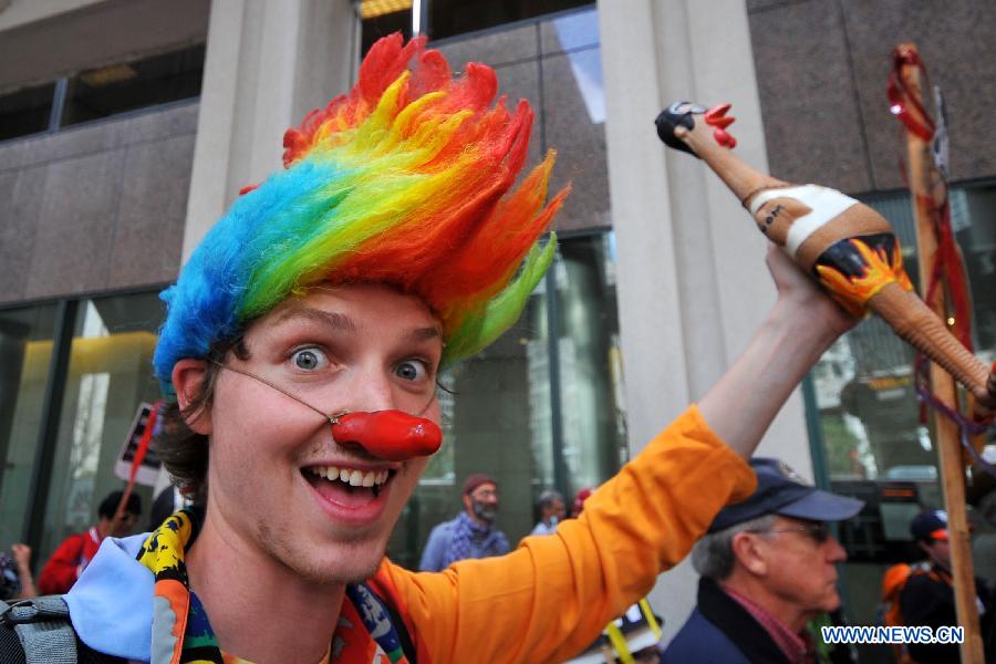 People take part in the annual St. Stupid's Day Parade held at the financial district in San Francisco, the United States, April 1, 2013. The 35th Annual St. Stupid's Day Parade was held on April Fool's Day in San Francisco. (Xinhua/Liu Yilin)