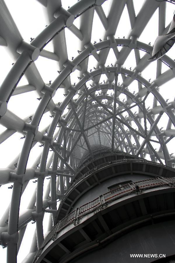 Photo taken on April 2, 2013 shows the Canton Tower Spider Walk in Guangzhou, capital of south China's Guangdong Province. The 1,000-meter-long Spider Walk locates at the 168-meter to 334.4-meter height of Canton Tower, with a transparent floor made up of 90 pieces of glasses. Visitors would get a general view of the scenery of Guangzhou City from the Spider Walk. (Xinhua/Shen Dunwen)