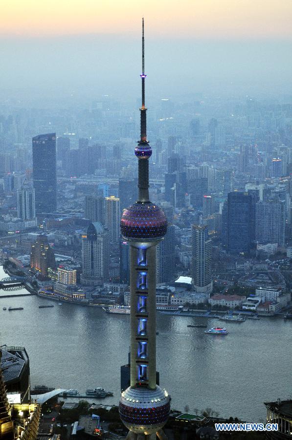 The Oriental Pearl TV Tower is illuminated in blue light to mark the World Autism Awareness Day in Shanghai, east China, April 2, 2013. (Xinhua/He Youbao)