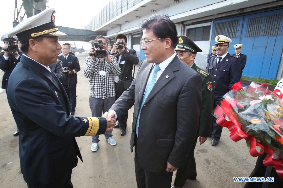 Li Xiaoyan (L), commander of the 13th Escort Taskforce of the Chinese Navy, shakes hands with Liu Yuhe, Chinese Ambassador to Algeria, at the habour of Algiers, Algeria, on April 2, 2013. The 13th naval escort squad, sent by the Chinese People's Liberation Army (PLA) Navy, arrived at Algiers of Algeria on Tuesday for a four-day visit after finishing its escort missions. (Xinhua/Mohamed Kadri) 