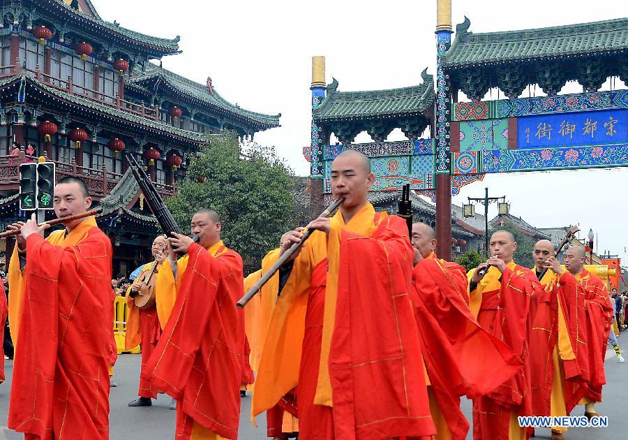 Monks play the musical instruments in a spring parade for the upcoming Tomb-sweeping Day in Kaifeng, central China's Henan Province, April 3, 2013. Thousands of performers and citizens participated in the parade. (Xinhua/Wang Song) 