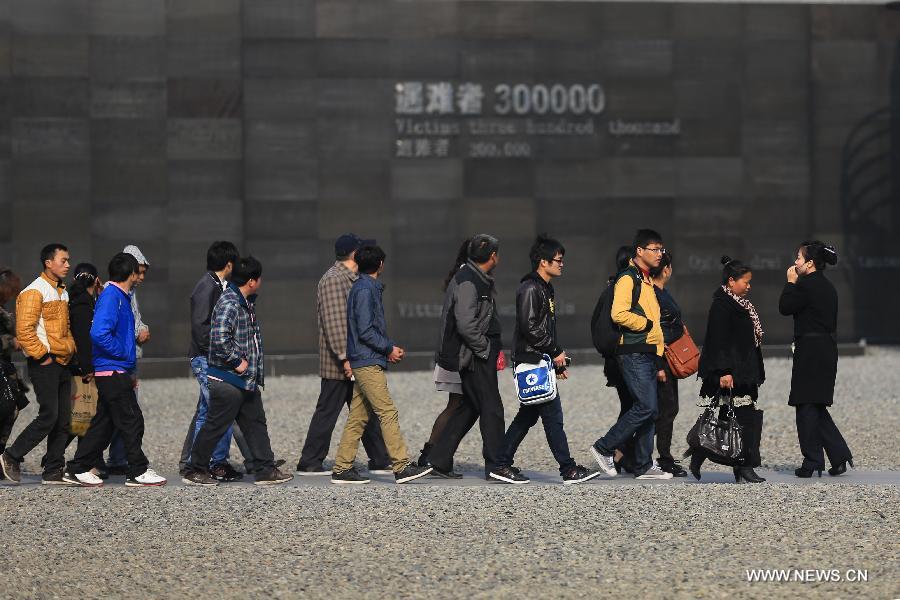 Tourists visit the Memorial Hall of the Victims in Nanjing Massacre by Japanese Invaders, in Nanjing, capital of east China's Jiansu Province, April 3, 2013. Lots of citizens came here to mourn Nanjing Massacre victims on the occassion of Qingming Festival, or Tomb-Sweeping Day, which falls on April 4 this year. (Xinhua/Han Hua) 