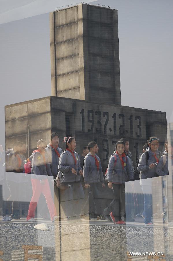 Students visit the Memorial Hall of the Victims in Nanjing Massacre by Japanese Invaders, in Nanjing, capital of east China's Jiansu Province, April 3, 2013. Lots of citizens came here to mourn Nanjing Massacre victims on the occassion of Qingming Festival, or Tomb-Sweeping Day, which falls on April 4 this year. (Xinhua/Han Hua)