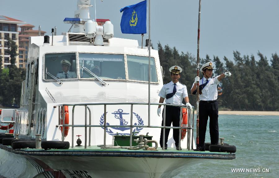 Staff members are on duty monitoring water areas around Boao, south China's Hainan Province, April 3, 2013. A fleet of five marine surveillance ships will monitor maritime traffic safety, investigate maritime accidents, detect pollution, and carry out other missions around the clock during the Boao Forum for Asia Annual Conference 2013 in Hainan. (Xinhua/Shi Manke)  