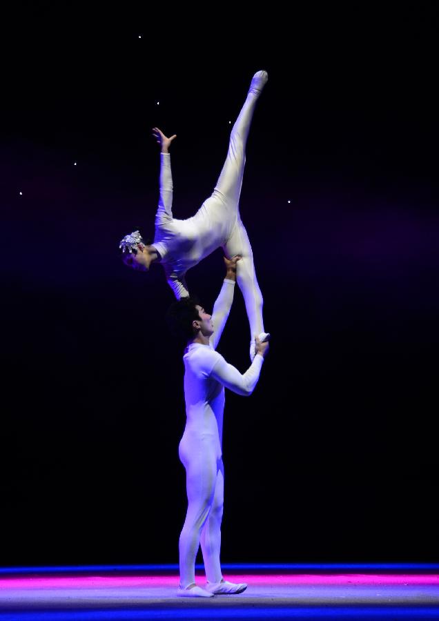 Members from the Guangzhou Acrobatics Troupe perform "Journey to the West" during the Fourth Lanzhou Art Festival in Lanzhou, capital of northwest China's Gansu Province, April 4, 2013. The performance retold the classic Chinese story of the same name. (Xinhua/Jia Xiaoyun)