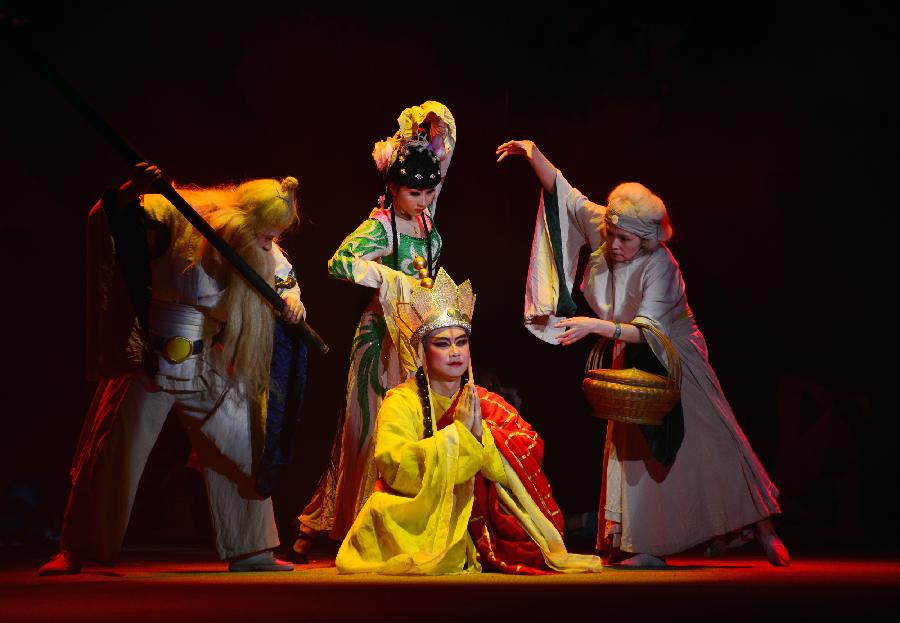 Members from the Guangzhou Acrobatics Troupe perform "Journey to the West" during the Fourth Lanzhou Art Festival in Lanzhou, capital of northwest China's Gansu Province, April 4, 2013. The performance retold the classic Chinese story of the same name. (Xinhua/Jia Xiaoyun)