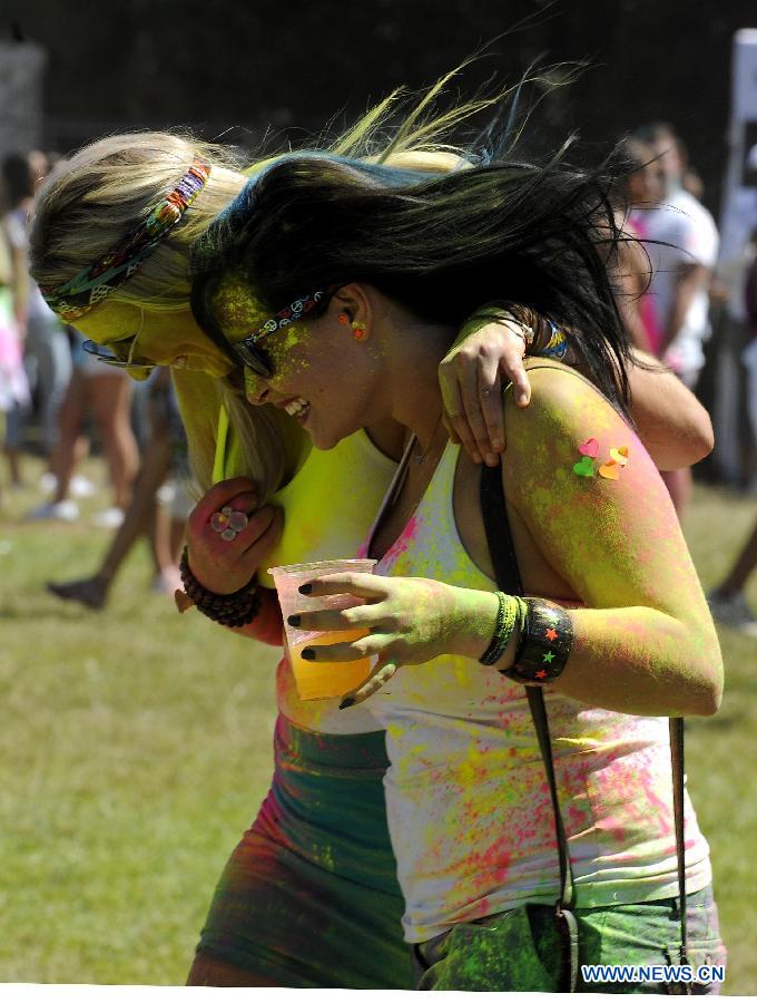 Revelers celebrate Holi, the Indian Festival of Colors, April 6, 2013. Holi is all about celebrating the colors and vitality of spring, with family and friends. (Xinhua/Li Qihua) 