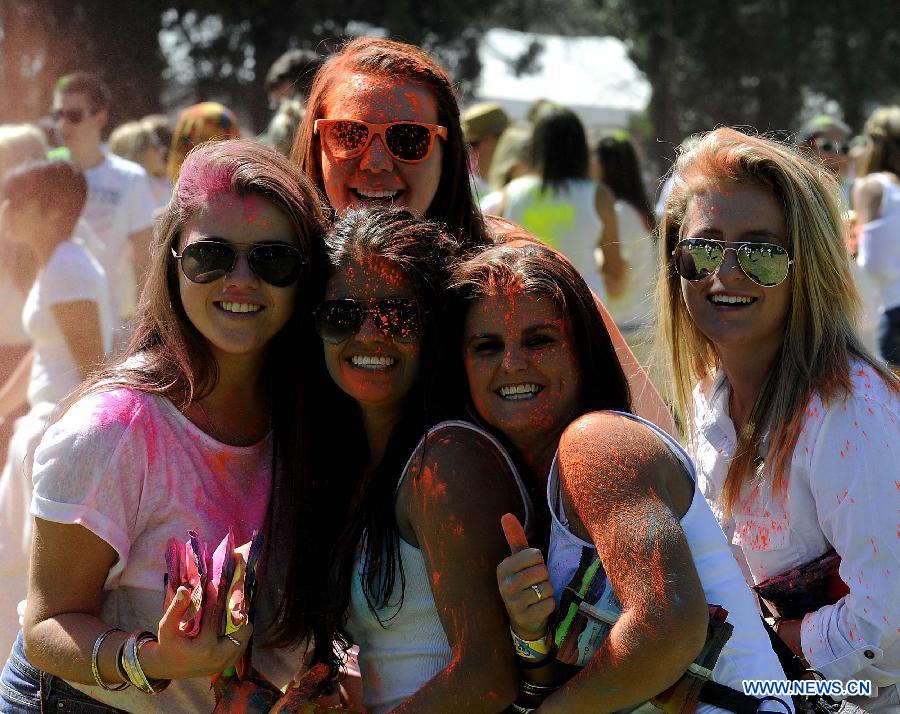 Revelers celebrate Holi, the Indian Festival of Colors, April 6, 2013. Holi is all about celebrating the colors and vitality of spring, with family and friends. (Xinhua/Li Qihua) 