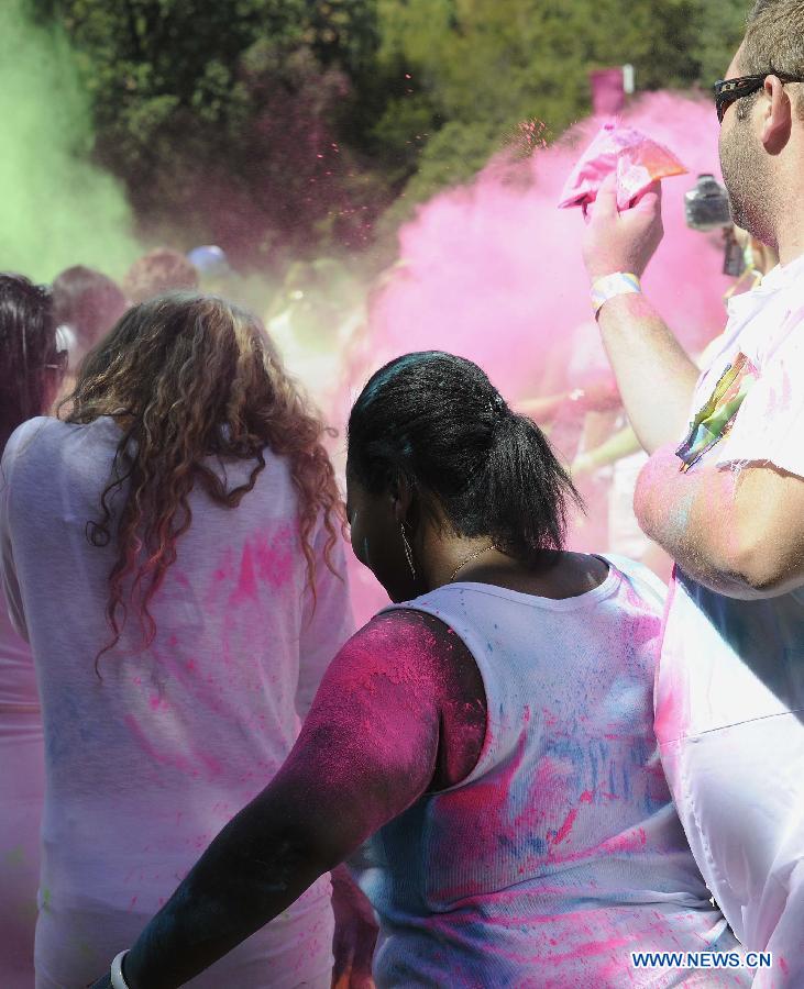 Revelers celebrate Holi, the Indian Festival of Colors, April 6, 2013. Holi is all about celebrating the colors and vitality of spring, with family and friends. (Xinhua/Li Qihua) 