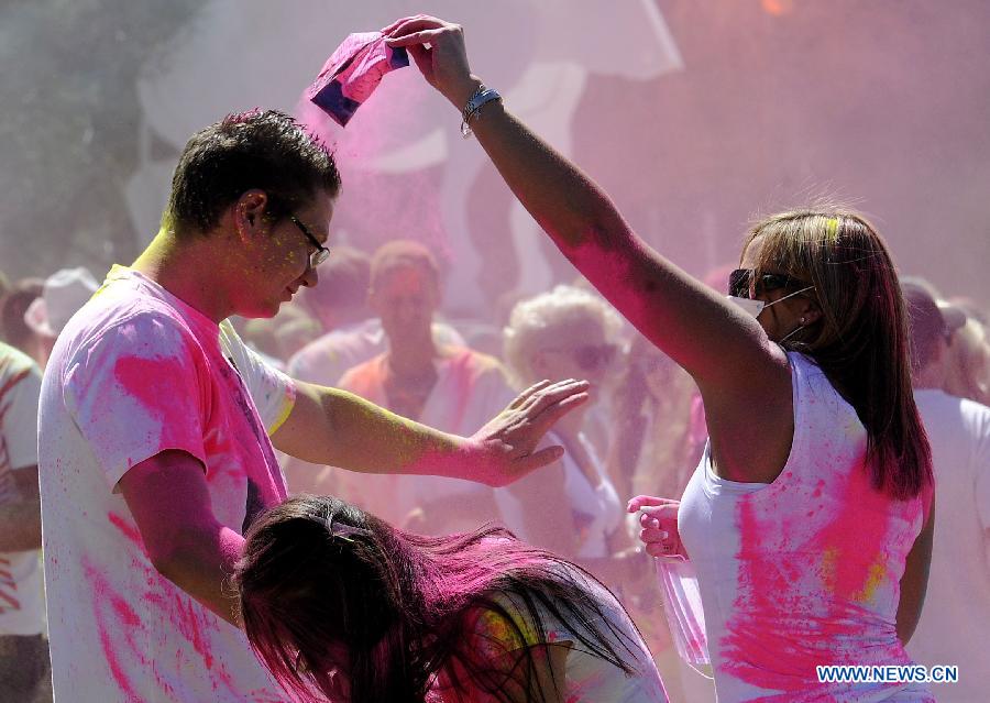 Revelers celebrate Holi, the Indian Festival of Colors, April 6, 2013. Holi is all about celebrating the colors and vitality of spring, with family and friends. (Xinhua/Li Qihua) 