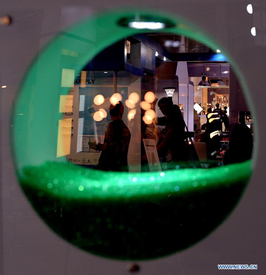 Visitors attend a lantern show in Hong Kong, south China, April 6, 2013. More than 1,000 exhibitors showcased their products in the four-day lantern show that kicked off on Saturday. (Xinhua/Chen Xiaowei) 